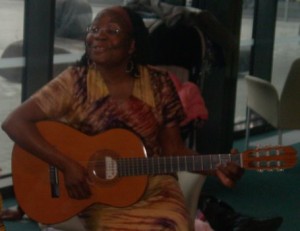 Jane Grell playing guitar